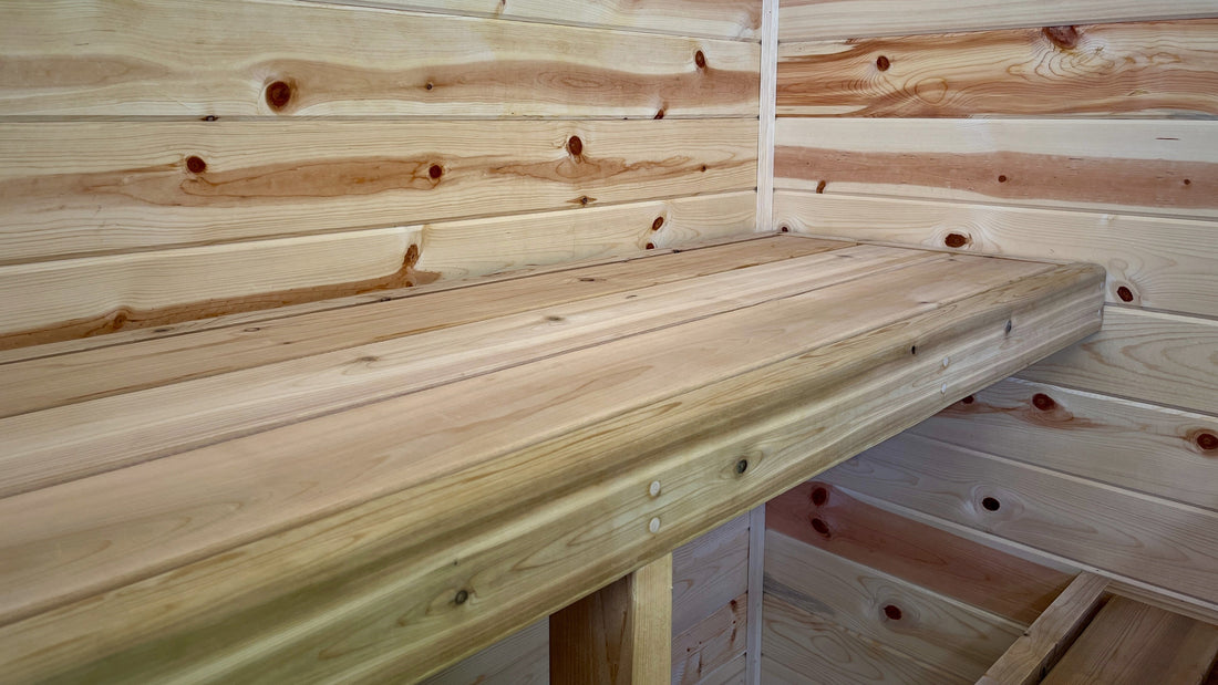 the inside of a pine wood sauna with cedar wood benches