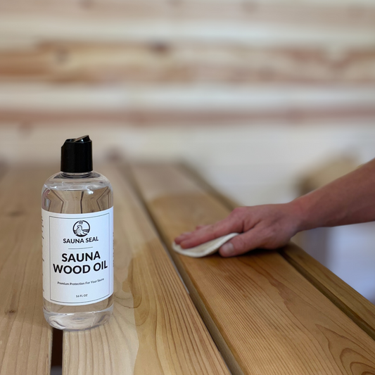Bottle of Sauna Seal Sauna Wood Oil with a person applying it to wooden surface