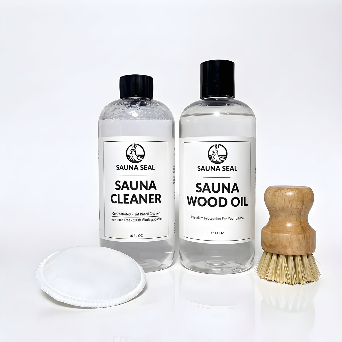 Sauna Seal Sauna Care Starter Kit: Sauna Cleaner 16oz, Sauna Wood Oil 16oz, applicator pad and bench scrub brush on a white background