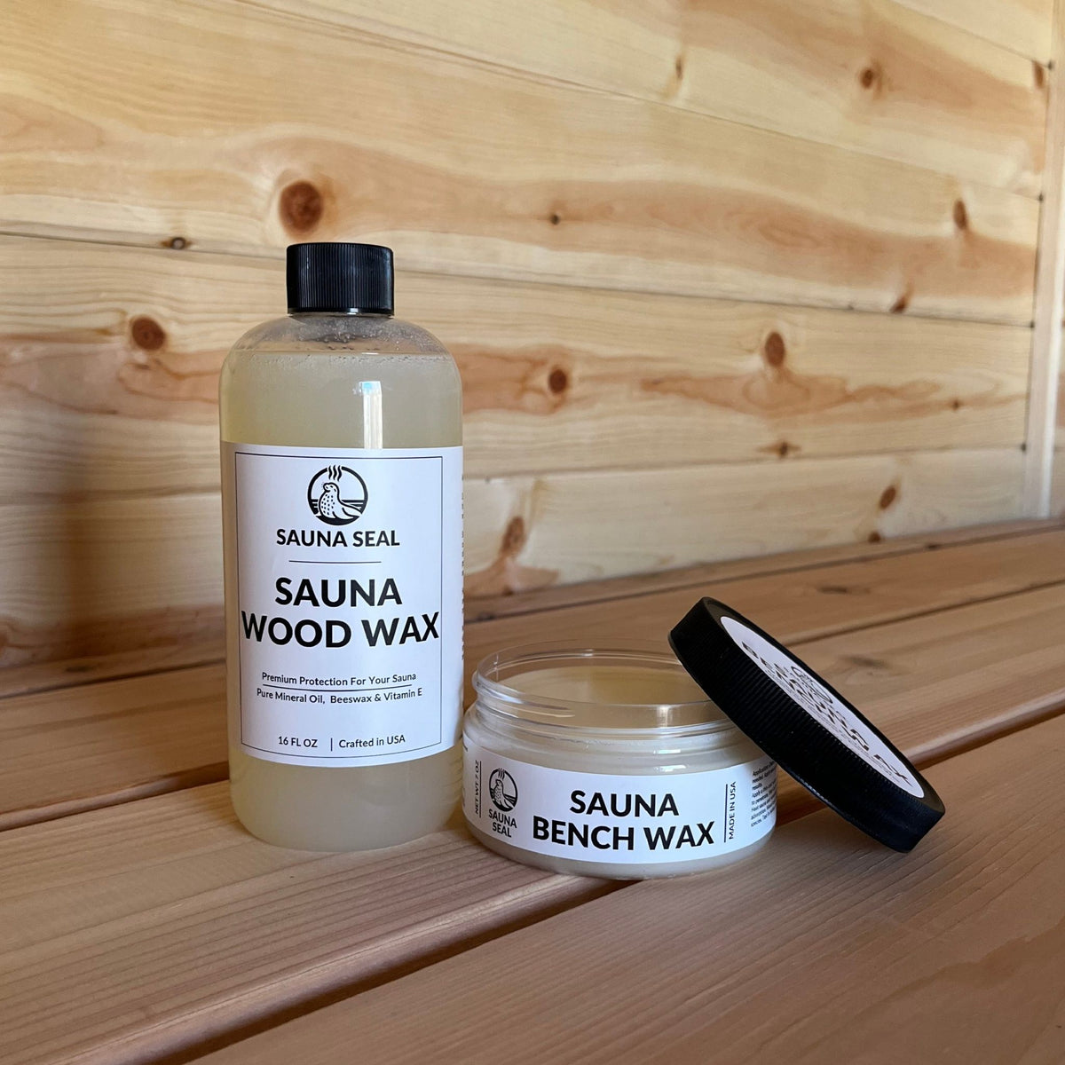 Sauna Seal Bench Wax Kit bottle and jar with white label on a wood sauna bench