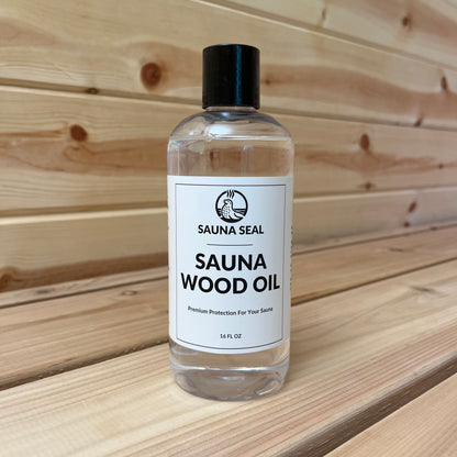 Sauna Seal Wood Oil 16oz bottle with white label, back cap a sauna wood background.