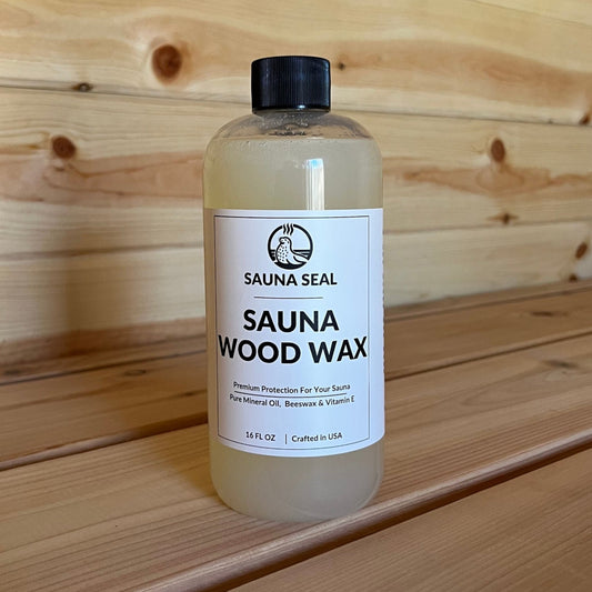 Sauna Seal Wood Wax bottle with white label on wood sauna bench
