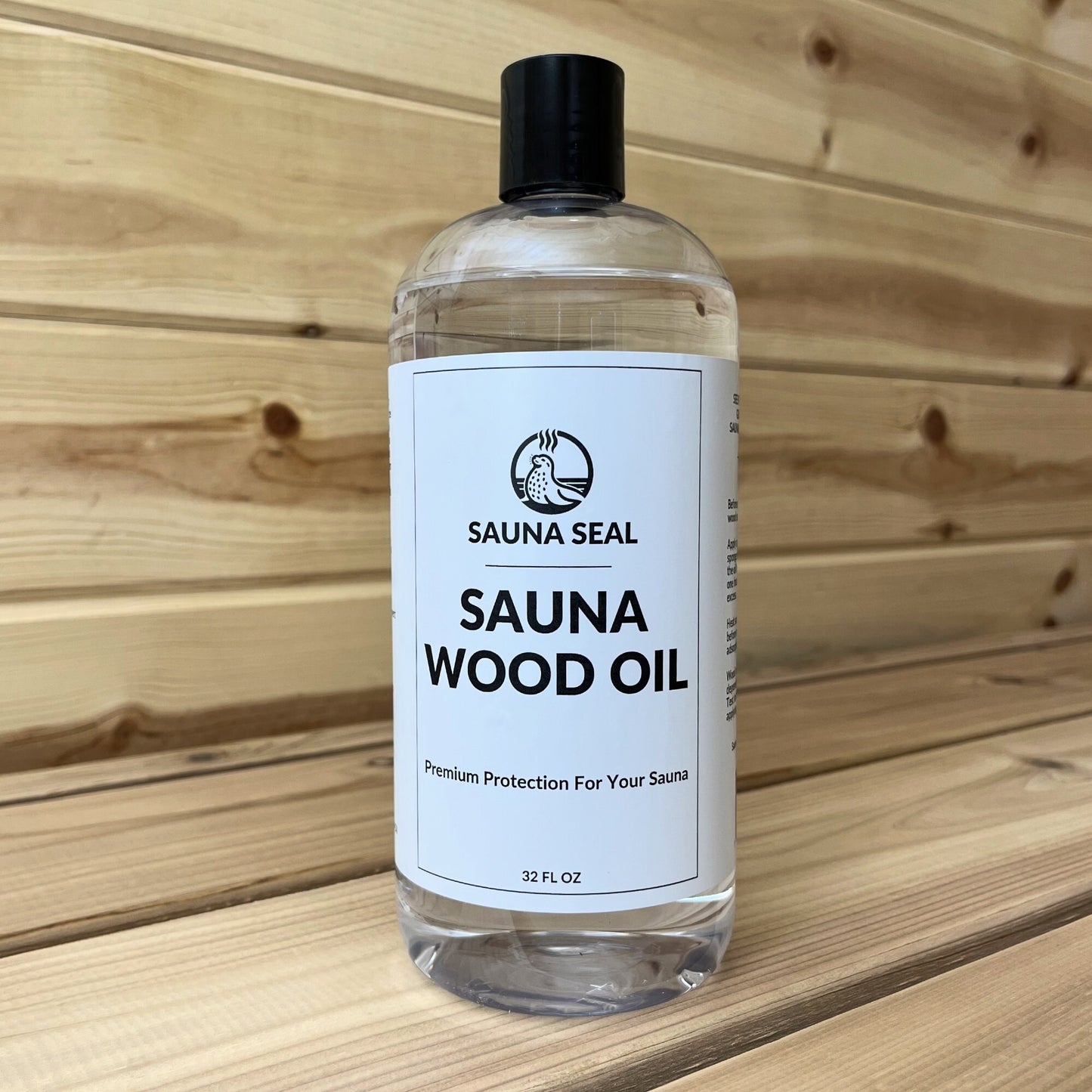 Bottle of Sauna Seal Sauna Wood Oil with a label on a wooden sauna bench and wall background