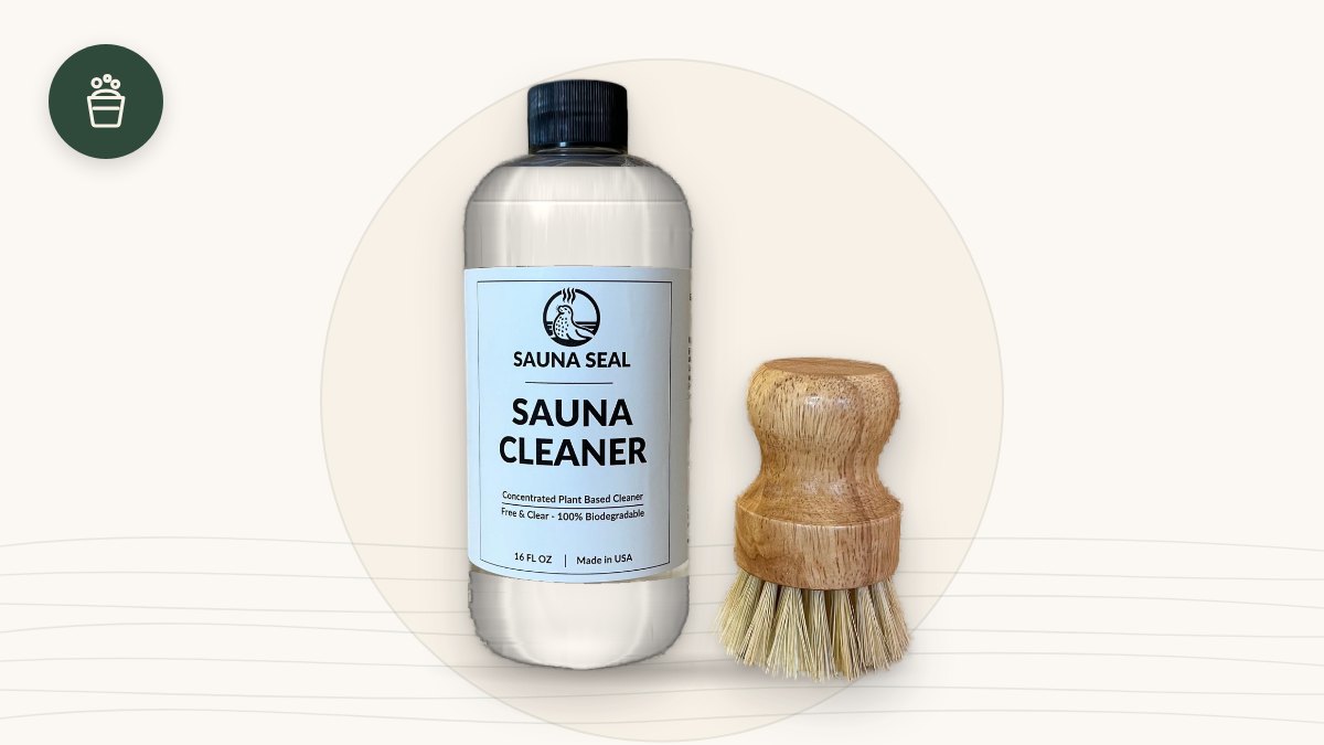 Sauna Seal Sauna Cleaner bottle and natural-bristle bench scrub brush on a cream background with a green cleaning icon