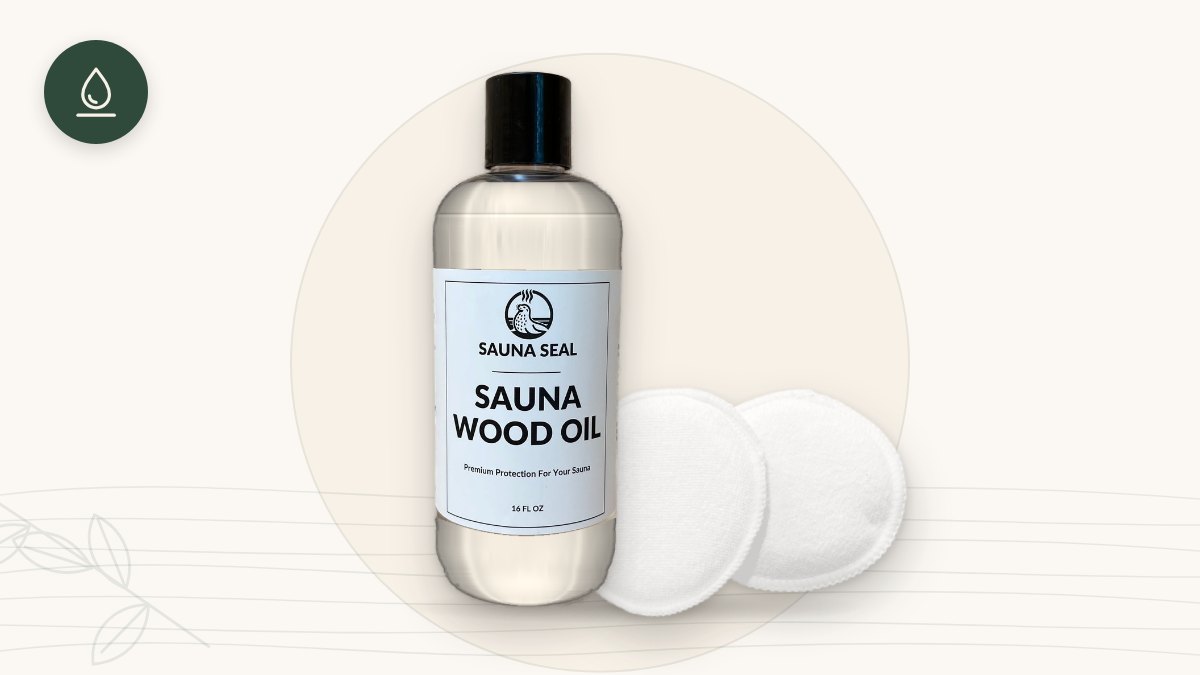 Sauna Seal Sauna Wood Oil bottle with two white applicator pads on a cream background with a green oil-drop icon